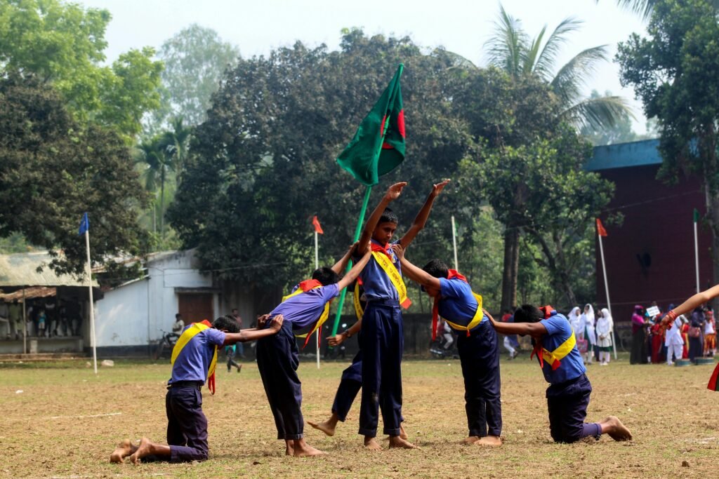 Boys Paying Tribute to Bangladesh Flag at Ceremony