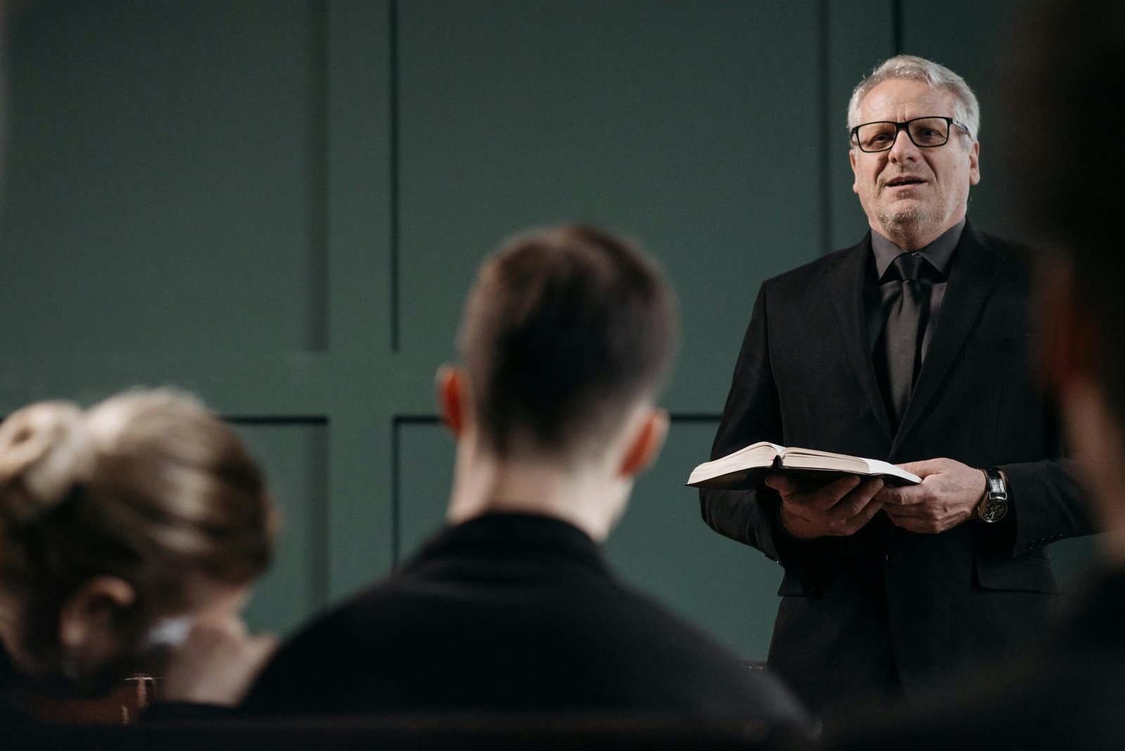 A Man Holding a Bible